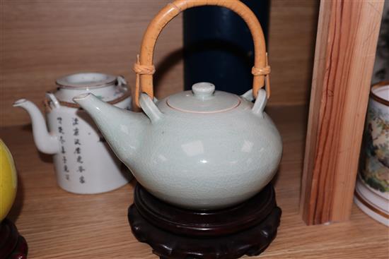 A Chinese famille rose teapot, a yellow glazed bottle vase, and a celadon glazed teapot vase 17cm incl. stand